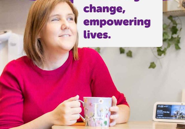 The front cover of our 2024 Impact Report. The cover features a woman, Laura, with a cup of tea and her Alexa device from BWBF. The title reads: Embracing change, empowering lives. Our impact in 2024.