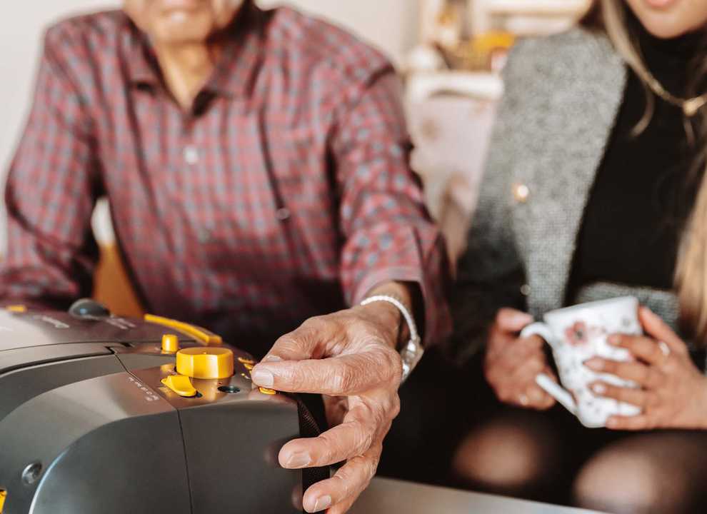 Man and his adult daughter with a radio.