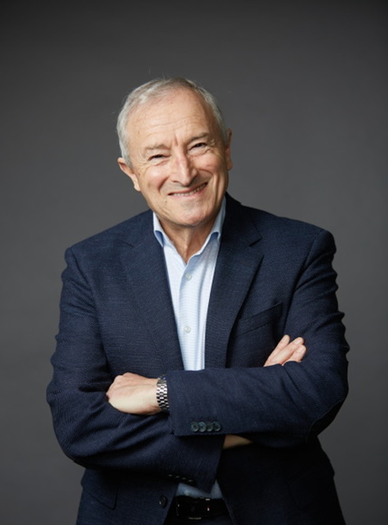 BWBF Patron Jim Rosenthal is wearing a dark suit and light shirt. He is smiling broadly.